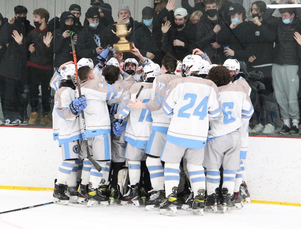 The South Burlington Wolves celebrate with the CSB cup after their 7-0 win over CVU on Wednesday night at Cairns Arena. The Wolves won the annual rivalry game for the fouth consecutive year.