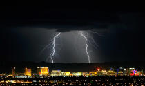 Lightning flashes east of the Las Vegas Strip during a thunderstorm early on 13 September. Stormy weather was expected to continue through Thursday.