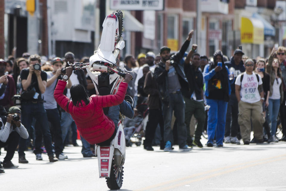 A motorcyclist rides Tuesday, April 28, 2015, in Baltimore. Maryland's governor vowed there would be no repeat of the looting, arson and vandalism that erupted Monday in some of the city's poorest neighborhoods. (AP Photo/Matt Rourke)