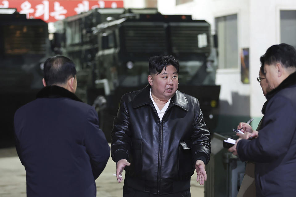 In this photo provided by the North Korean government, North Korean leader Kim Jong Un, center, inspects as he tours munitions factories in North Korea on Jan. 8-9, 2024. Independent journalists were not given access to cover the event depicted in this image distributed by the North Korean government. The content of this image is as provided and cannot be independently verified. Korean language watermark on image as provided by source reads: "KCNA" which is the abbreviation for Korean Central News Agency. (Korean Central News Agency/Korea News Service via AP)