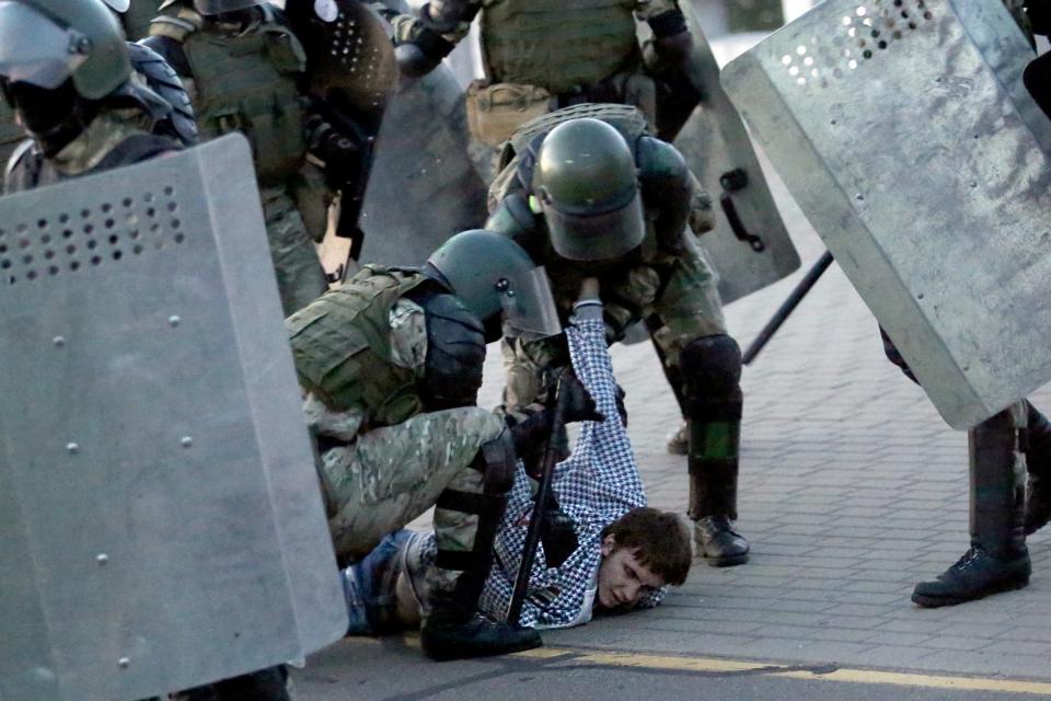 Police detain a man during an opposition rally in Minsk (TUT.BY/AFP via Getty Images)