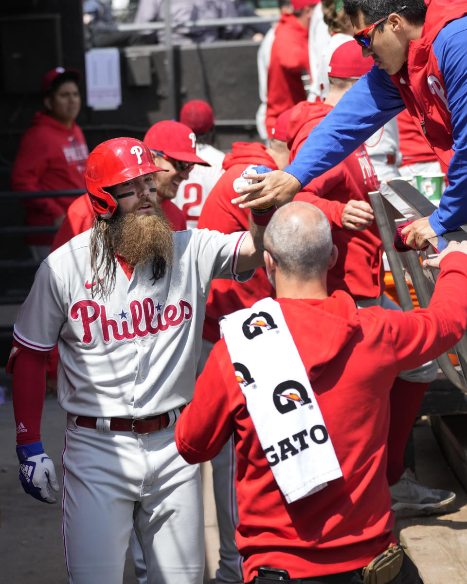 Philadelphia Phillies' Brandon Marsh celebrates his home run off Chicago White Sox starting pitcher Mike Clevinger in the dugout during the second inning of a baseball game Wednesday, April 19, 2023, in Chicago. (AP Photo/Charles Rex Arbogast)