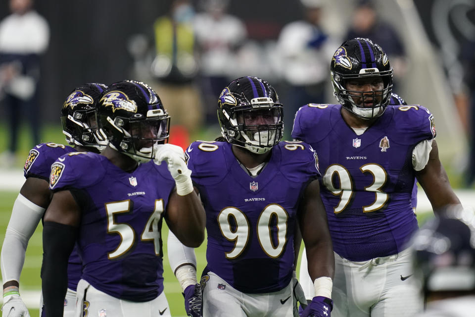 Baltimore Ravens defenders Pernell McPhee (90) Calais Campbell (93) prepare for the next play during an NFL football game against the Houston Texans, Sunday, Sept. 20, 2020, in Houston. In the midst of an NFL season that is course to set records for the most points and touchdowns, the Baltimore Ravens and Pittsburgh Steelers are winning on the strength of their defense. (AP Photo/Matt Patterson)