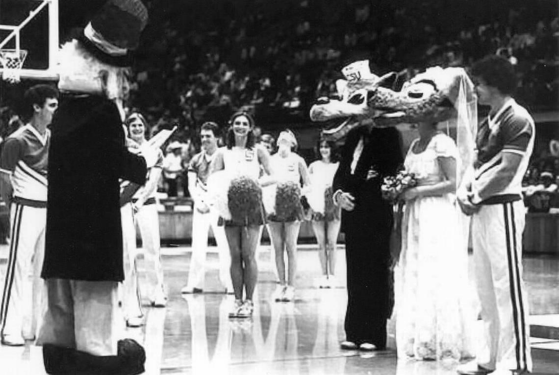 Mr. and Ms. Wuf, the mascots for N.C. State University athletic teams, were married during halftime of the Wolfpack’s basketball game against Wake Forest on Feb. 28, 1981, at Reynolds Coliseum. The Wake Forest Demon Deacon mascot presided. Photo Courtesy of N.C. State/Photo Courtesy of N.C. State