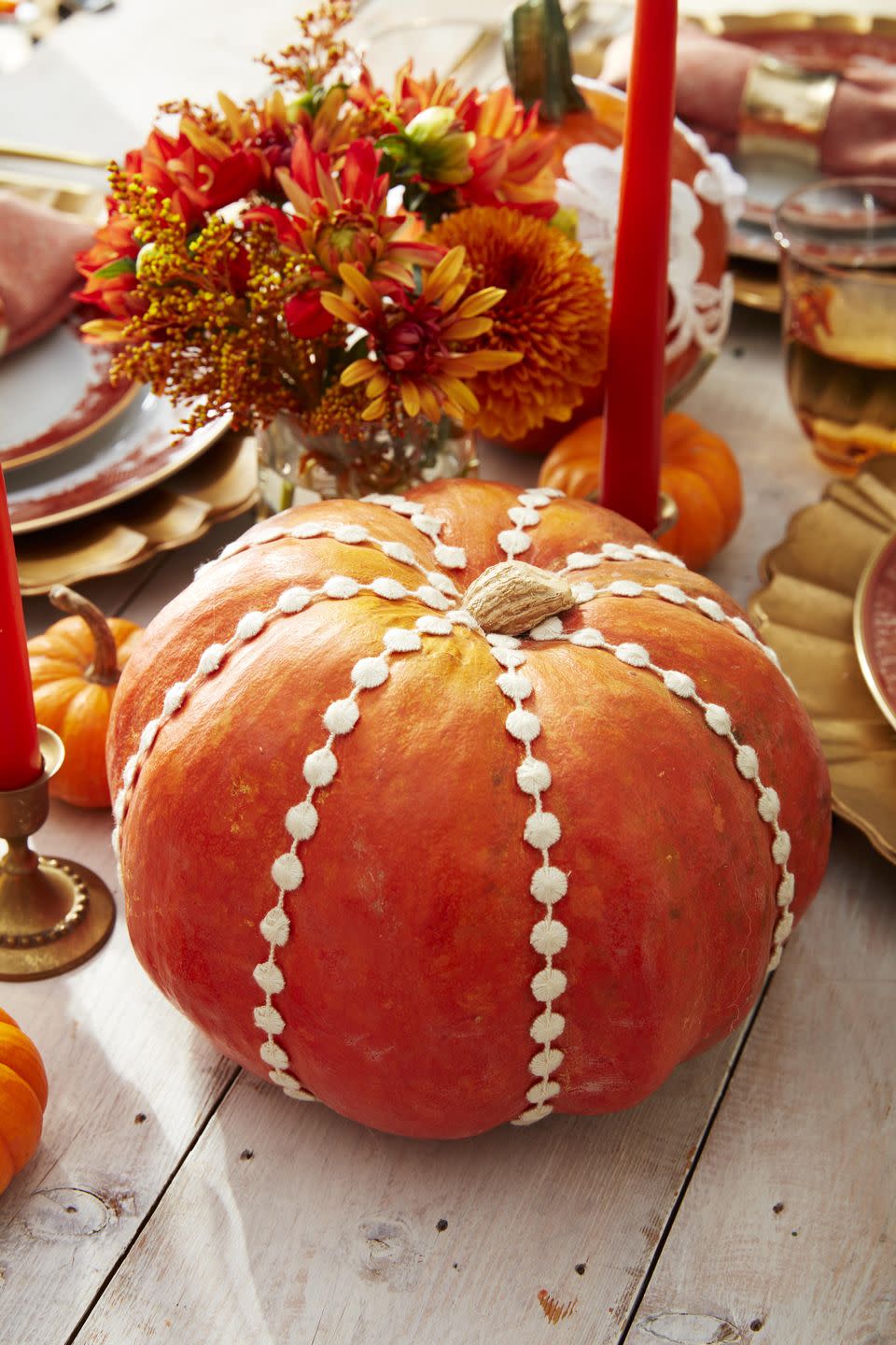 <p>Shop the sewing section to create this sweet pumpkin. Simply attach lengths of sewing trim to the top and bottom of a pumpkin, allowing it to sit in the pumpkin’s natural grooves, with hot-glue</p><p><a class="link " href="https://www.amazon.com/Altotux-inches-White-Circle-Venice/dp/B00MOWFLW4/ref=sr_1_3?linkCode=ogi&tag=syn-yahoo-20&ascsubtag=%5Bartid%7C10050.g.2063%5Bsrc%7Cyahoo-us" rel="nofollow noopener" target="_blank" data-ylk="slk:Shop Sewing Trim;elm:context_link;itc:0;sec:content-canvas">Shop Sewing Trim</a></p>