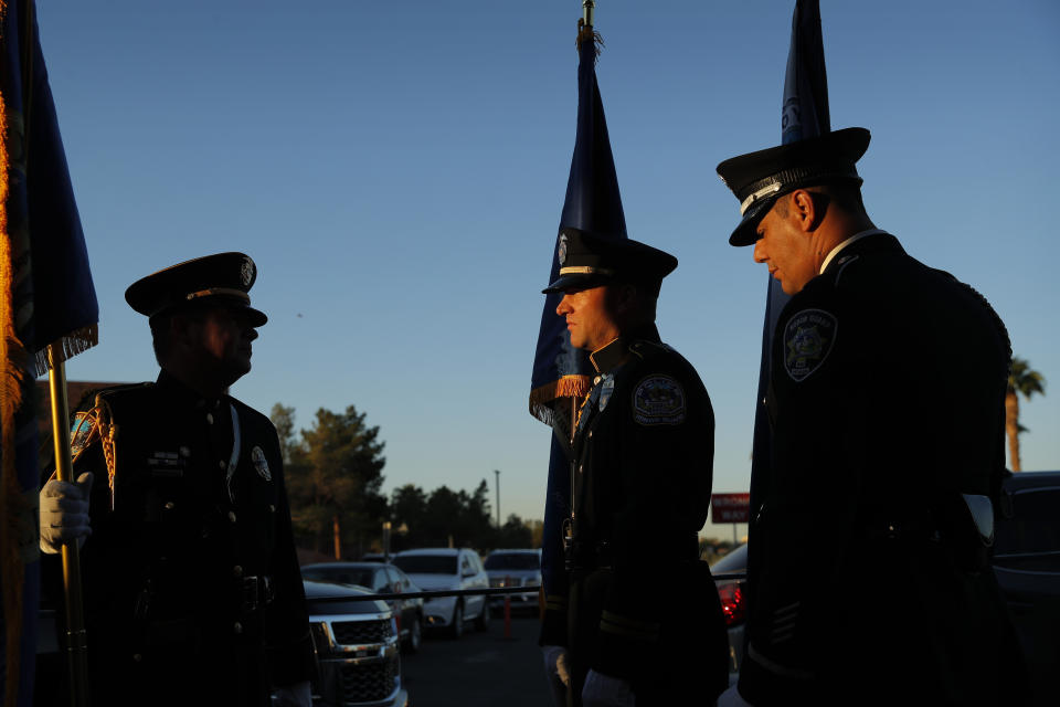 Members of a law enforcement color guard prepare to participate in a ceremony Tuesday, Oct. 1, 2019, on the anniversary of the mass shooting two years earlier in, Las Vegas. (AP Photo/John Locher)