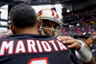 Atlanta Falcons quarterback Marcus Mariota embraces San Francisco 49ers quarterback Jimmy Garoppolo after an NFL football game, Sunday, Oct. 16, 2022, in Atlanta. The Atlanta Falcons won 28-14. (AP Photo/Brynn Anderson)