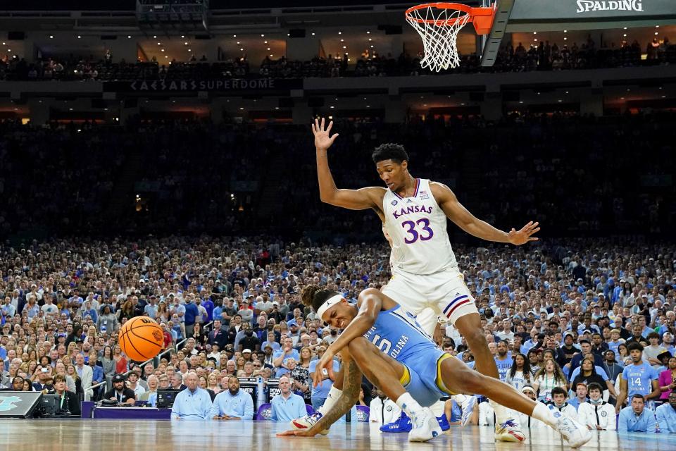 Apr 4, 2022; New Orleans, LA, USA; North Carolina Tar Heels forward Armando Bacot (5) reacts after sustaining an apparent injury following a play against the Kansas Jayhawks during the second half during the 2022 NCAA men's basketball tournament Final Four championship game at Caesars Superdome. Mandatory Credit: Bob Donnan-USA TODAY Sports