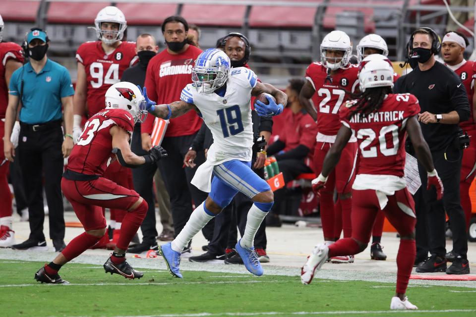 Wide receiver Kenny Golladay (19) of the Detroit Lions runs with the football after a reception against cornerback Byron Murphy (33) of the Arizona Cardinals in the second half of the NFL game at State Farm Stadium on Sept. 27, 2020 in Glendale, Arizona.  The Lions defeated the Cardinals 26-23.