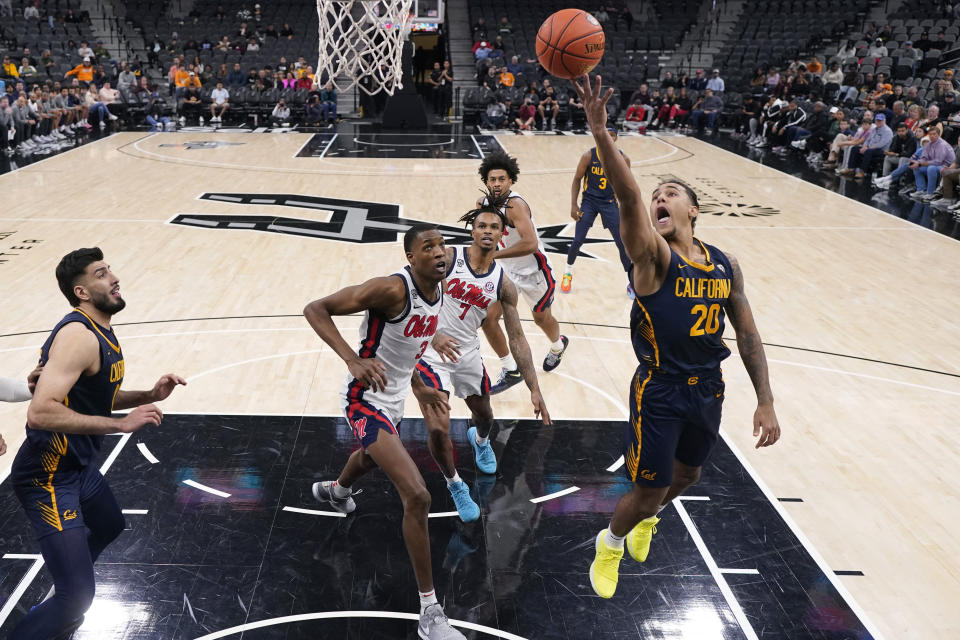 California guard Jaylon Tyson (20) scores past Mississippi forward Jamarion Sharp (3) during the first half of an NCAA college basketball game in San Antonio, Saturday, Dec. 16, 2023. (AP Photo/Eric Gay)