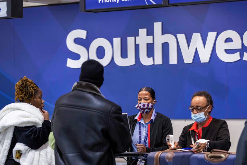 FILE PHOTO: Passengers wait for the flights to resume at Hartsfield-Jackson Atlanta International Airport in Atlanta