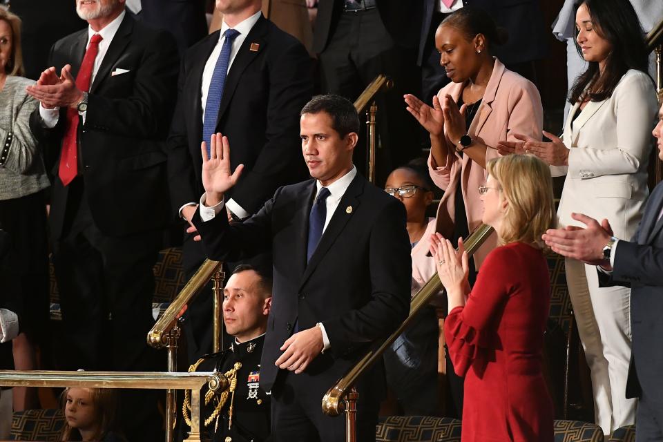 Venezuelan opposition leader Juan Guaido (C) waves as he is acknowledged by US President Donald Trump during his the State of the Union address at the US Capitol in Washington, DC, on February 4, 2020. (Mandel Ngan/AFP via Getty Images)