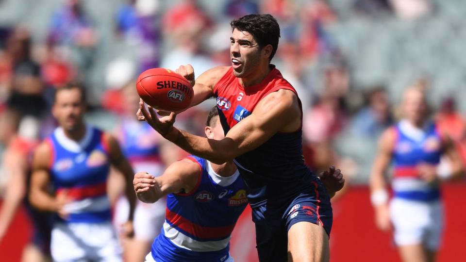 Christian Petracca catches the ball for Melbourne. 
