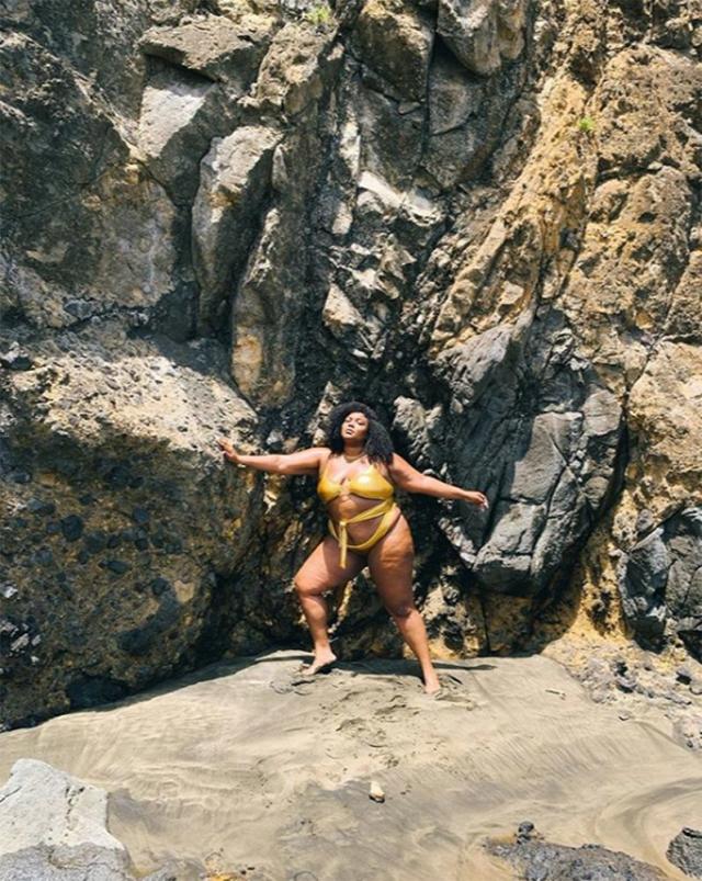 Lizzo Shares Sexy Beachside Bikini Pics, Calls Herself A 'Roll Model