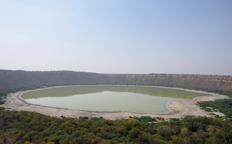 Lonar Crater and its saline lake in India's Maharashtra state is the location of a remnant of an asteroid impact around 50,000 years ago. The crater has become a key area for investigations into the geology of the underlying Deccan Traps.