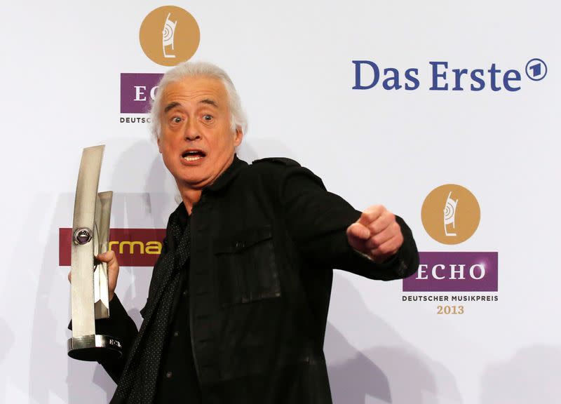 FILE PHOTO: Page of band Led Zeppelin poses with award during Echo Music Awards ceremony in Berlin