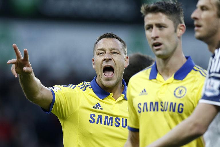 Chelsea's John Terry (L) instructs his teammates during their English Premier League match against West Bromwich Albion, at The Hawthorns in West Bromwich, central England, on May 18, 2015