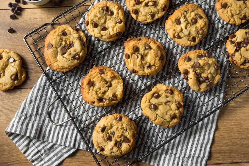 Chocolate chip cookies cooling off on a wired baking rack