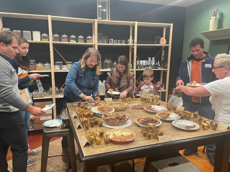 Guests taste pecan pies at The MacPherson House 3rd Annual Great Fayetteville Pecan Pie Bake Off, Nov. 20, 2021.