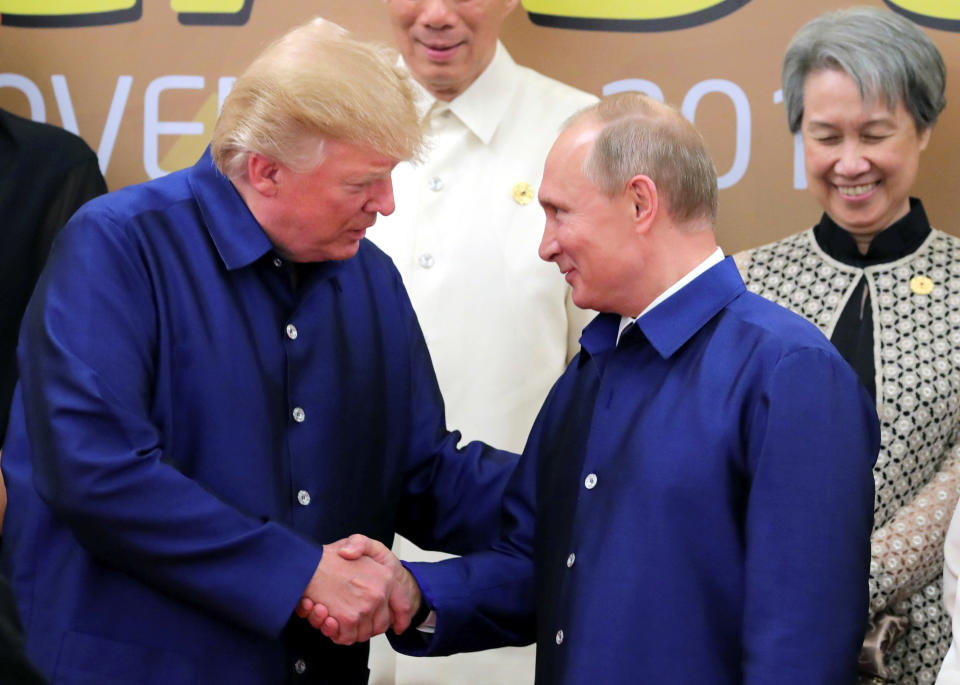 <p>President Donald Trump and Russian President Vladimir Putin shake hands as they take part in a family photo at the APEC summit in Danang, Vietnam, Nov. 10, 2017. (Photo: Sputnik/Mikhail Klimentyev/Kremlin via Reuters) </p>