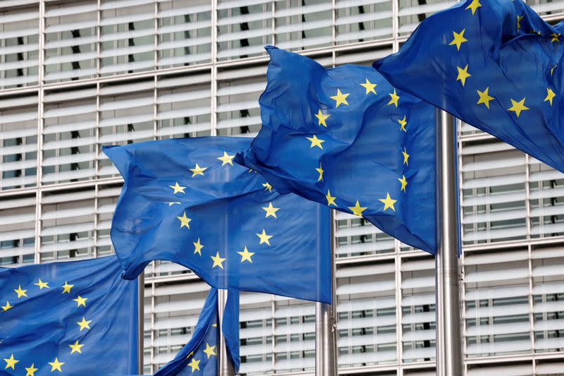 FILE PHOTO: European Union flags flutter outside the EU Commission headquarters in Brussels