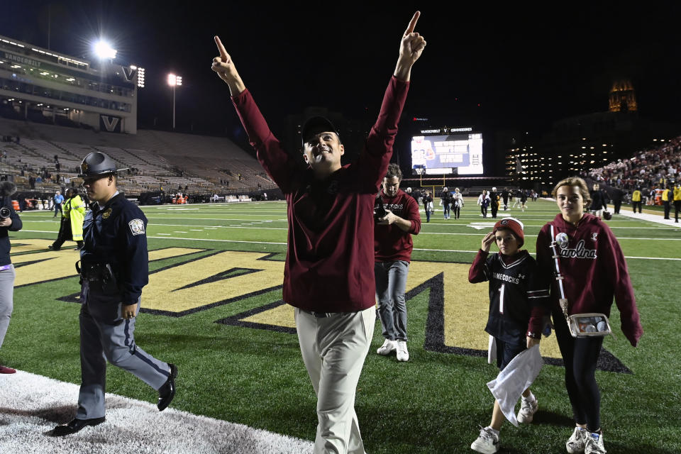 South Carolina head coach Shane Beamer, center, celebrates as he walks off the field after his team's win over Vanderbilt in an NCAA college football game Saturday, Nov. 5, 2022, in Nashville, Tenn. (AP Photo/Mark Zaleski)