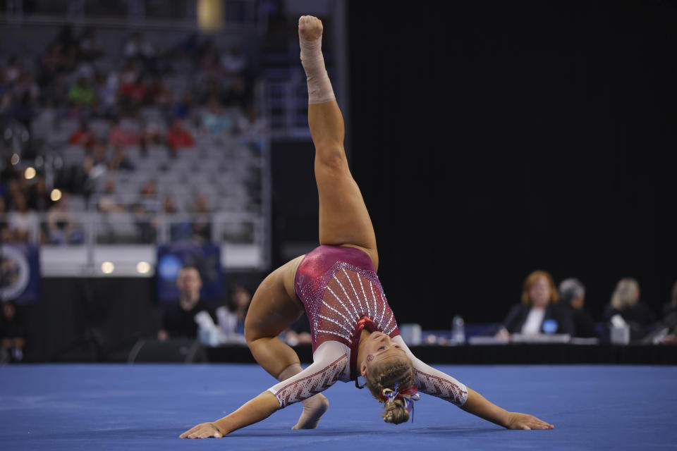 Oklahoma's Ragan Smith competes in the floor exercise during the NCAA college women's gymnastics championships, Saturday, April 16, 2022, in Fort Worth, Texas. (AP Photo/Gareth Patterson)