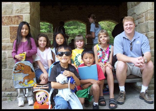 Kevin Quevillon with children of the Boys & Girls Club of Portage County.