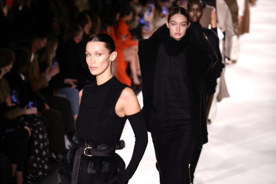 MILAN, ITALY – FEBRUARY 24: Bella Hadid and Gigi Hadid walk the runway at the Max Mara fashion show during the Milan Fashion Week Fall/Winter 2022/2023 on February 24, 2022 in Milan, Italy. (Photo by Andreas Rentz/Getty Images)