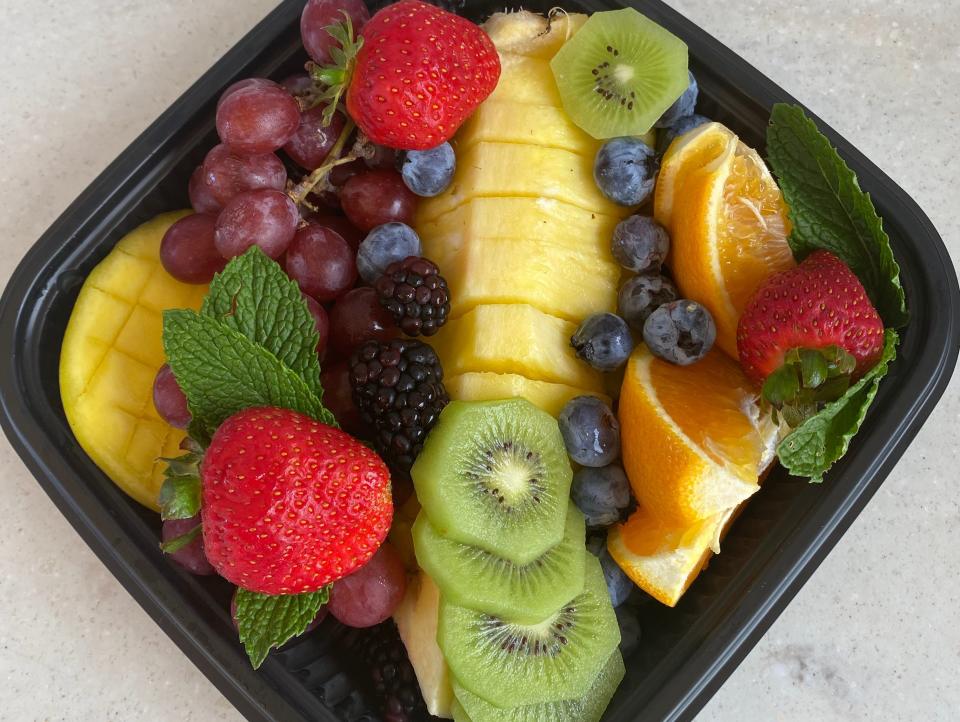fruit platter in a black container at disney's yacht club private cabana
