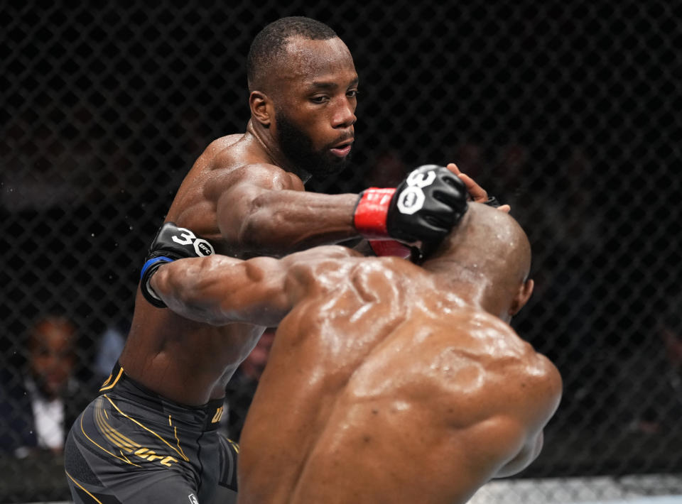 LONDON, ENGLAND - MARCH 18: (L-R) Leon Edwards of Jamaica punches Kamaru Usman of Nigeria in the UFC welterweight championship fight during the UFC 286 event at The O2 Arena on March 18, 2023 in London, England. (Photo by Jeff Bottari/Zuffa LLC via Getty Images)