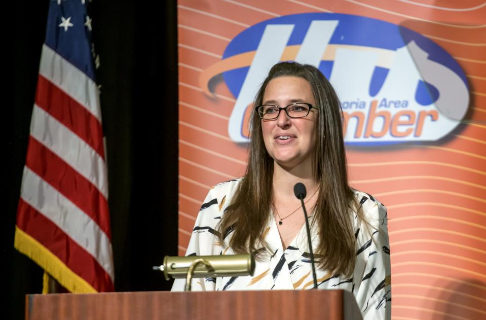 Lifeline Pilots executive director Lindsey Kerr accepts the Community Wealth Award for the non-profit during the annual Peoria Area Chamber of Commerce Thanksgiving Luncheon on Thursday, Nov. 16, 2023 at the Peoria Civic Center.