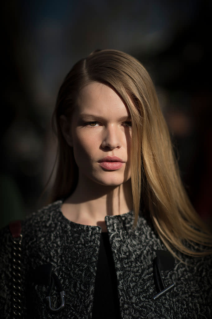 <p>Or you can run a straightener through the face-framing pieces, like German model Anna Ewers, for a sleeker finish. (Photo by Timur Emek/Getty Images) </p>