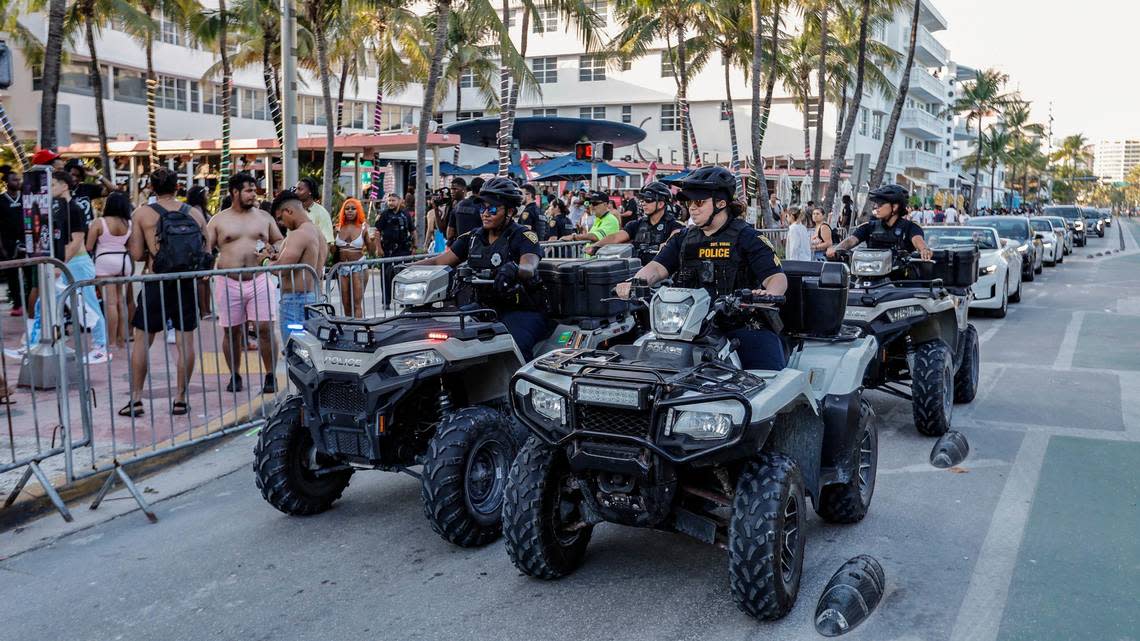 Miami Beach police officers patrol along Ocean Drive on their ATVs during spring break on Miami Beach, Florida on Sunday, March 17, 2024.