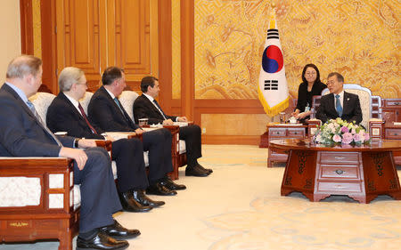 South Korean President Moon Jae-in talks with delegation of the Olympic Athletes from Russia during their meeting at the Presidential Blue House in Seoul, South Korea, February 20, 2018. Yonhap via REUTERS