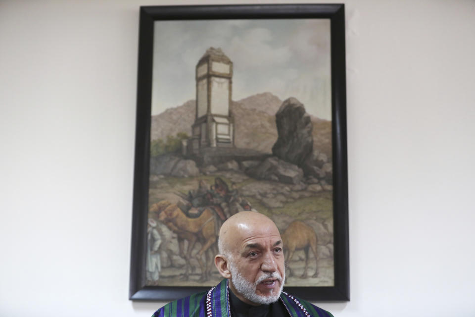 Former Afghan President Hamid Karzai speaks during an interview with the Associated Press in Kabul, Afghanistan, Thursday, March 11, 2021. Afghans are eager for peace and a recently floated U.S. draft for a deal between Taliban insurgents and the Afghan government is the best chance to accelerate stalled peace talks, ex-president Hamid Karzai said in an interview Thursday. (AP Photo/Rahmat Gul)