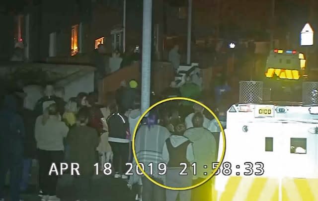 CCTV still of Lyra McKee (circled) within the crowd watching a protest in Londonderry before she was shot