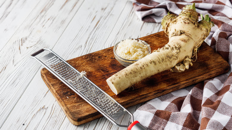 Fresh horseradish on cutting board