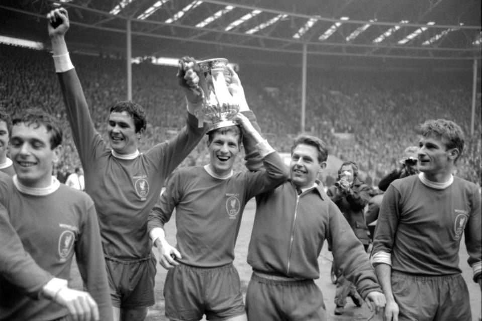 Roger Hunt (right) after Liverpool win the 1965 FA Cup (PA)