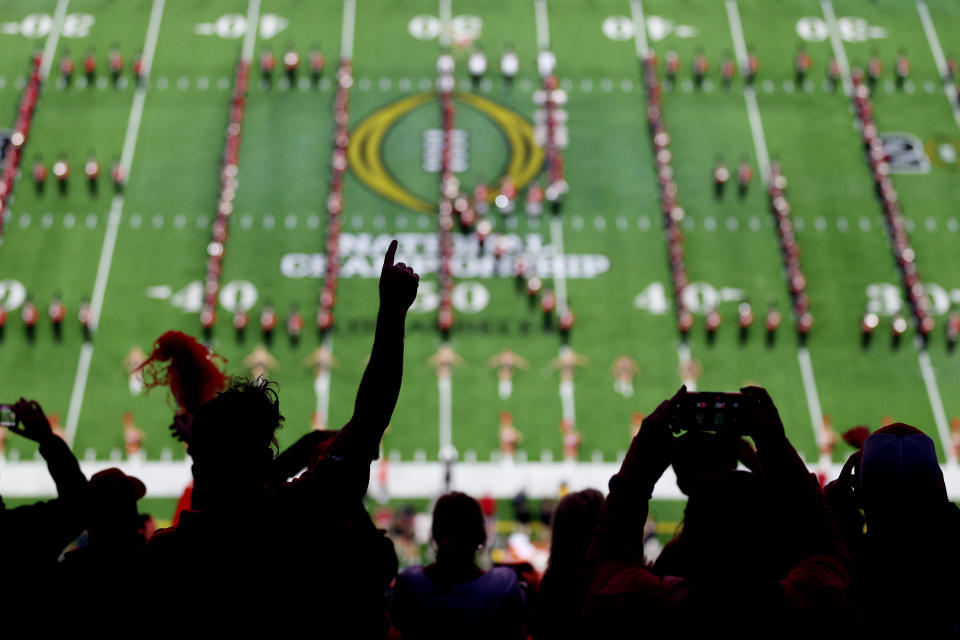 Fans react as the Georgia Bulldogs band performs before the College Football Playoff national championship game against the TCU Horned Frogs at SoFi Stadium on January 09, 2023 in Inglewood, California. (Photo by Ezra Shaw/Getty Images)
