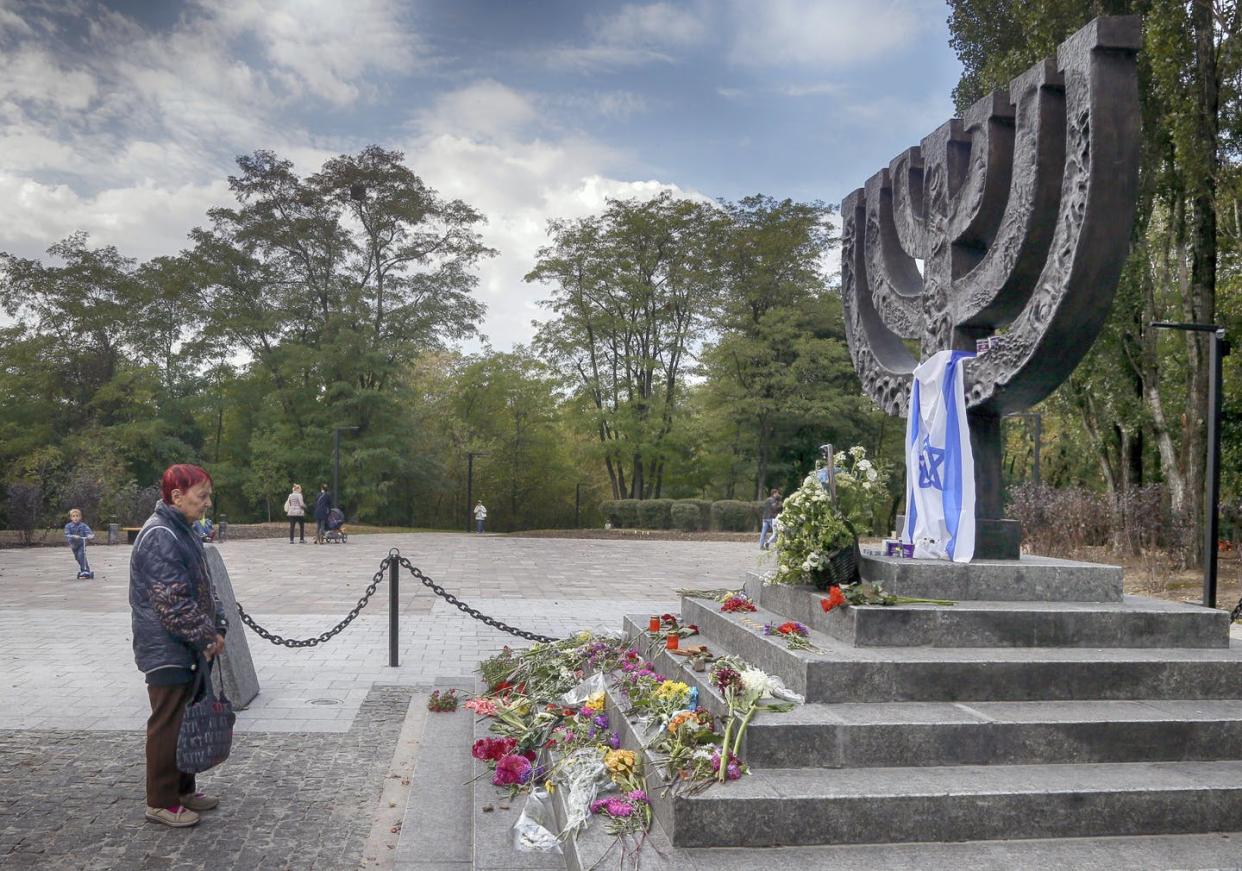 <span class="caption">A woman pays homage at the memorial to victims of the 1941 Nazi massacre of Jews in Babi Yar in Kyiv, Ukraine.</span> <span class="attribution"><a class="link " href="https://newsroom.ap.org/detail/UkraineBabiYar/313b23d830954c4eb3f0d980b5d296e0/photo?Query=baby%20yar&mediaType=photo&sortBy=&dateRange=Anytime&totalCount=2&currentItemNo=1" rel="nofollow noopener" target="_blank" data-ylk="slk:AP Photo/Efrem Lukatsky;elm:context_link;itc:0;sec:content-canvas">AP Photo/Efrem Lukatsky</a></span>