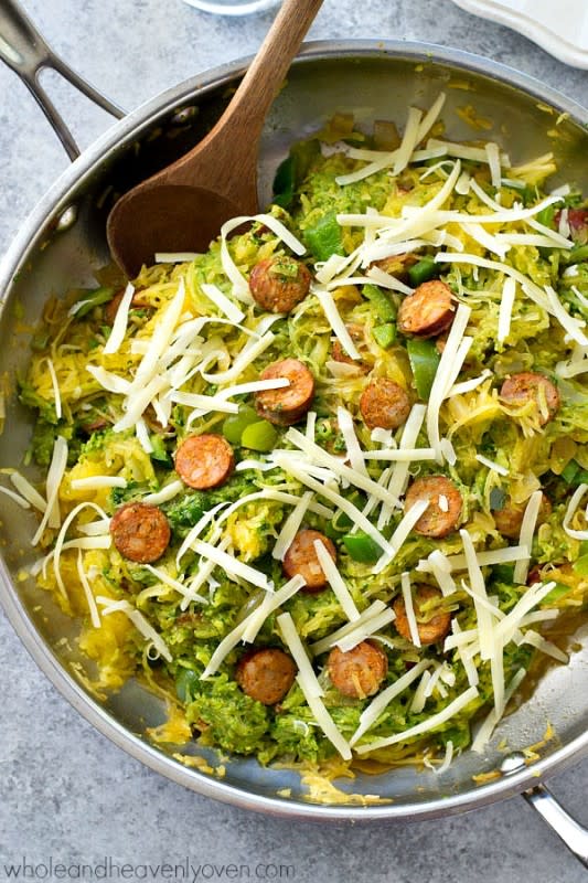 <p>Whole and Heavenly Oven</p><p>Spaghetti squash loaded with flavorful pesto and lots of sliced sausage! An easy and healthy skillet dinner with only 7 ingredients!</p><p><a href="http://wholeandheavenlyoven.com/2016/04/19/pesto-spaghetti-squash-sausage-skillet/" rel="nofollow noopener" target="_blank" data-ylk="slk:Get the recipe here!;elm:context_link;itc:0;sec:content-canvas" class="link rapid-noclick-resp"><em><strong>Get the recipe here!</strong></em></a></p>