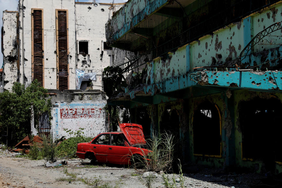A dilapidated car and building are seen at the most affected war-torn area of Marawi City, Lanao del Sur province, Philippines. (Photo: Eloisa Lopez/Reuters)