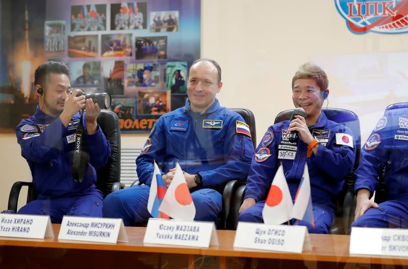 Space flight participants attend a news conference in Baikonur