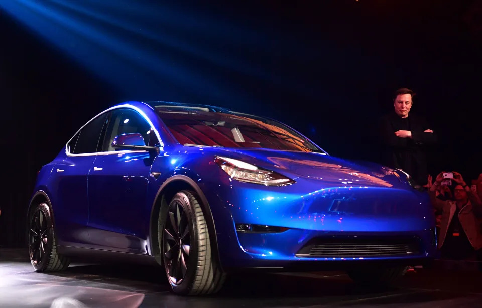 Tesla CEO Elon Musk views the new Tesla Model Y at its unveiling in Hawthorne, California on March 14, 2019. (Photo by Frederic J. BROWN / AFP) (Photo credit should read FREDERIC J. BROWN/AFP/Getty Images)