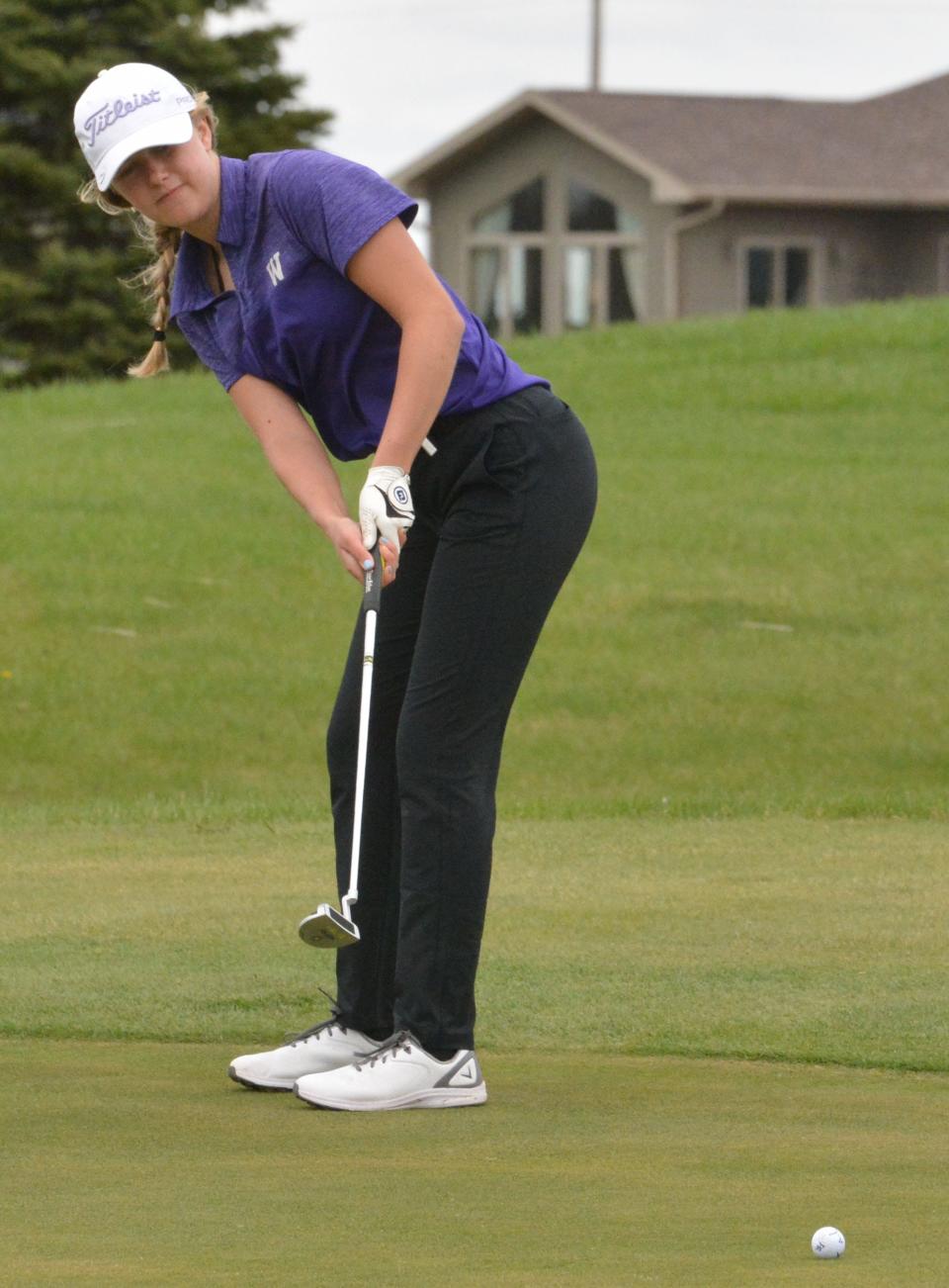 Watertown's Aspen Reynolds tracks her putt on No. 5 Red on Tuesday during the Watertown Girls Golf Invitational at Cattail Crossing Golf Course.
