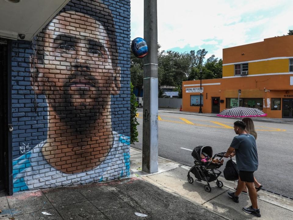 A mural depicting Lionel Messi is seen in Miami on Wednesday, the same day the global football superstar announced he will be signing a deal with Inter Miami of Major League Soccer.  (Giorgio Viera/AFP/Getty Images - image credit)