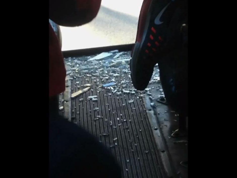 The back window of the bus was smashed by the crash into a tree: 7 News Boston