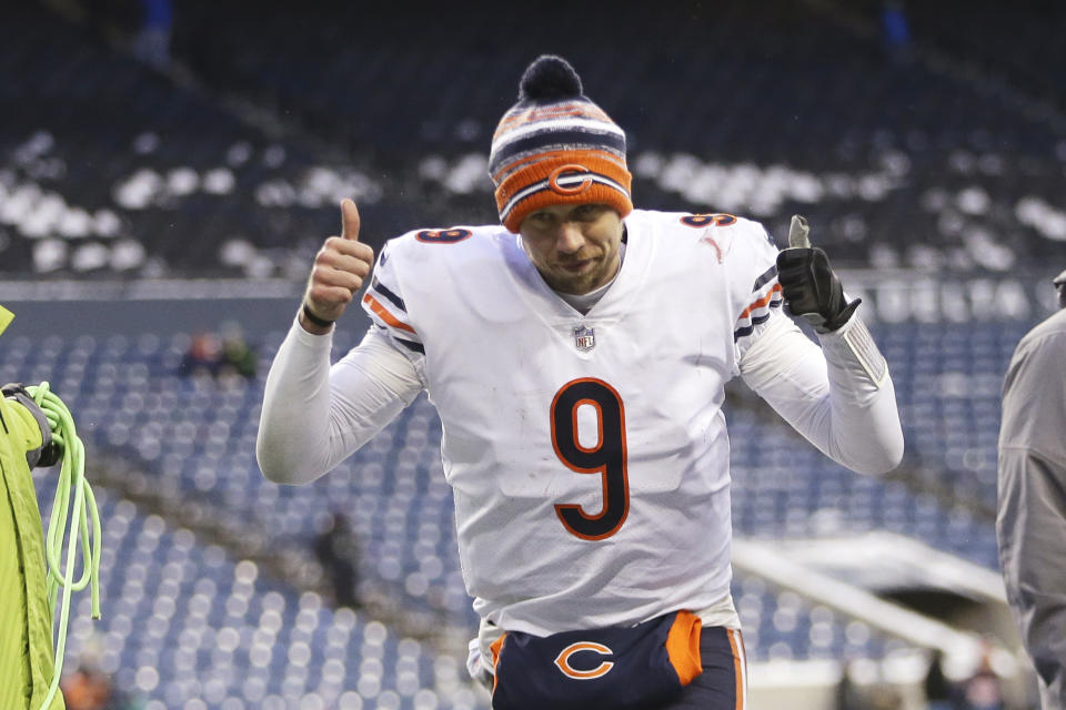 Chicago Bears quarterback Nick Foles gives a thumbs-up as he heads off the field after the team beat the Seattle Seahawks in an NFL football game, Sunday, Dec. 26, 2021, in Seattle. The Bears won 25-24. (AP Photo/Lindsey Wasson)