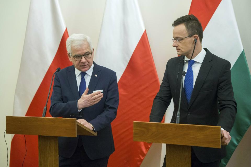 Hungarian Minister of Foreign Affairs and Trade Peter Szijjarto, right, and Polish Minister of Foreign Affairs Jacek Czaputowicz hold a joint press conference at the Minister of Foreign Affairs and Trade in Budapest, Hungary, Wednesday, Feb. 27, 2019. (Zoltan Balogh/MTI via AP)